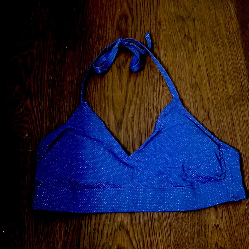 It’s a lightly sparkled blue bikini and v neck, very cute I just don’t wear it